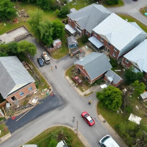 Aerial view of destruction in Kentucky caused by storms with emergency responders